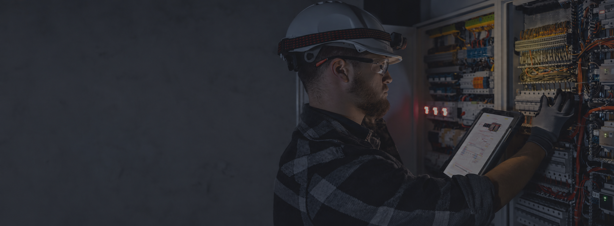 Industrial-Technician-Inspecting-Control-Panel