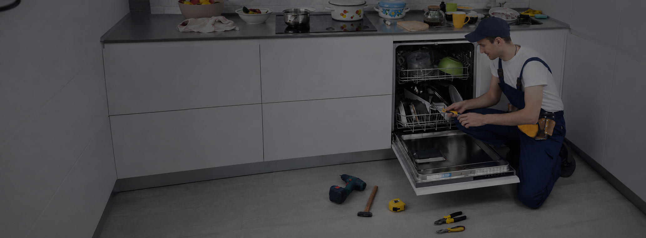 Technician-Repairing-Dishwasher-in-Modern-Kitchen